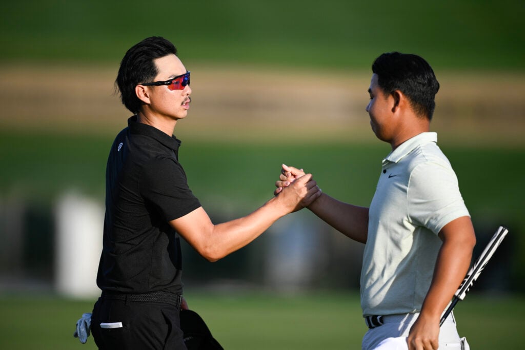 Tom Kim and Min Woo Lee shake hands after the opening round at The American Express