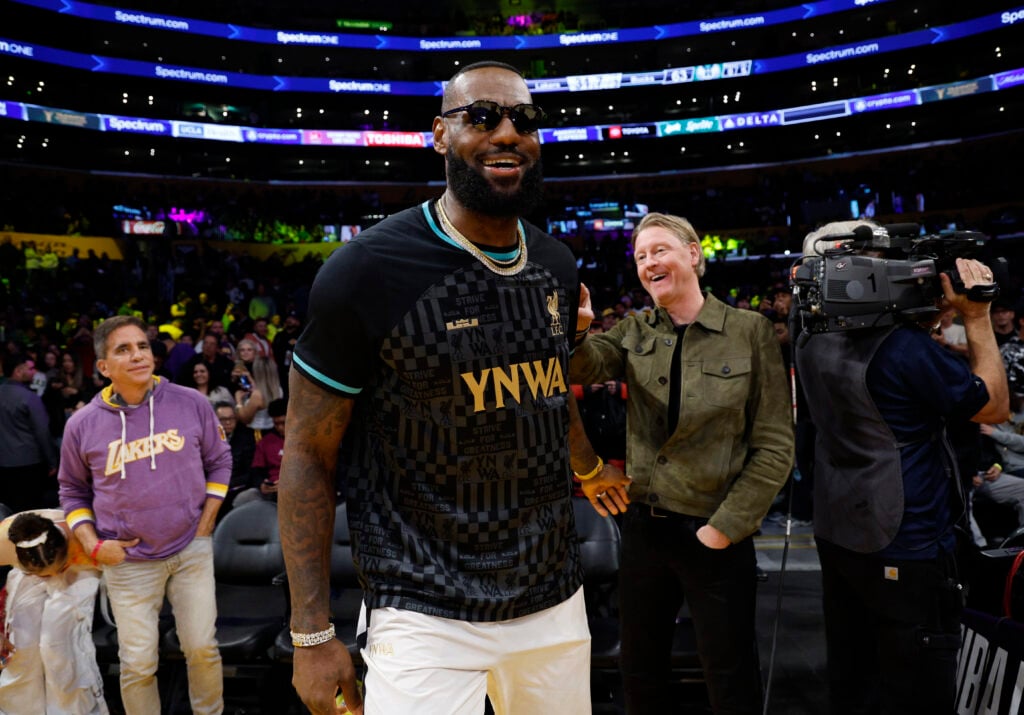 LeBron James #23 of the Los Angeles Lakers wearing a Liverpool FC jersey attends the game between Los Angeles Lakers and Milwaukee Bucks at Crypto.com Arena on March 8, 2024 in Los Angeles, California.