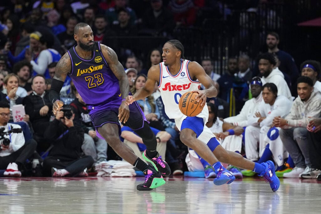 Tyrese Maxey #0 of the Philadelphia 76ers drives against LeBron James #23 of the Los Angeles Lakers in the first half at the Wells Fargo Center on January 28, 2025.