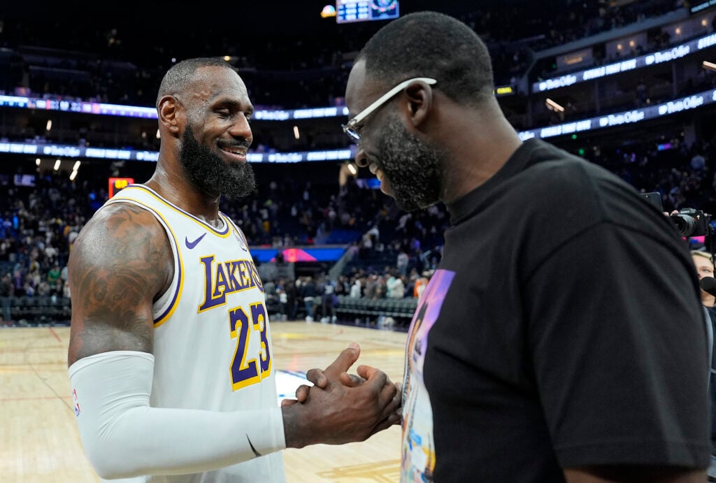 LeBron James #23 of the Los Angeles Lakers shakes hands with Draymond Green #23 of the Golden State Warriors after the Lakers defeated the Warriors 118-108 at Chase Center.