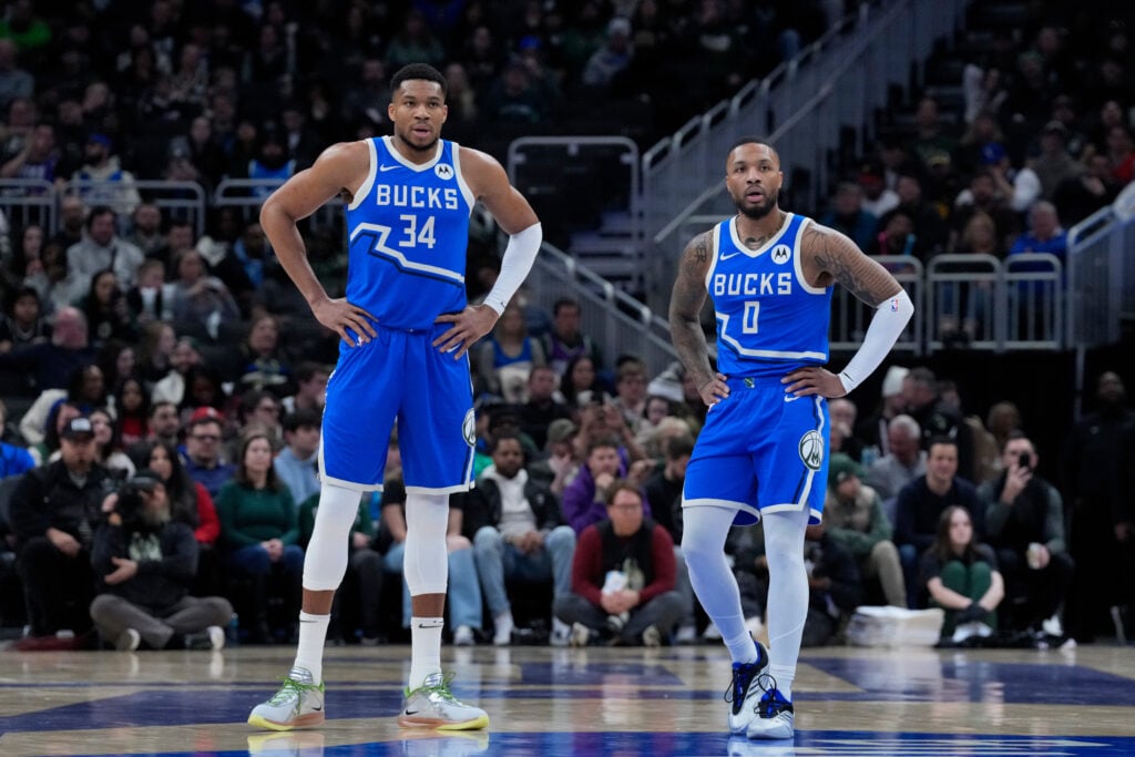 Giannis Antetokounmpo #34 and Damian Lillard #0 of the Milwaukee Bucks look on during the first half of the game against the Miami Heat at Fiserv Forum on February 23, 2025 in Milwaukee, Wisconsin.