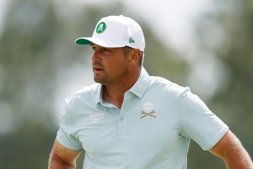 Bryson DeChambeau of the United States reacts after putting for par on the 18th hole during the second round of the 2025 Masters Tournament at Augusta National Golf Club