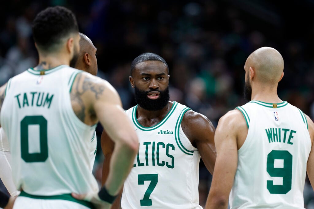 Boston Celtics forward Jayson Tatum (0), center Al Horford, guard Jaylen Brown and guard Derrick White talk in the fourth quarter of Game 1 of the NBA Eastern Conference semifinal at TD Garden.