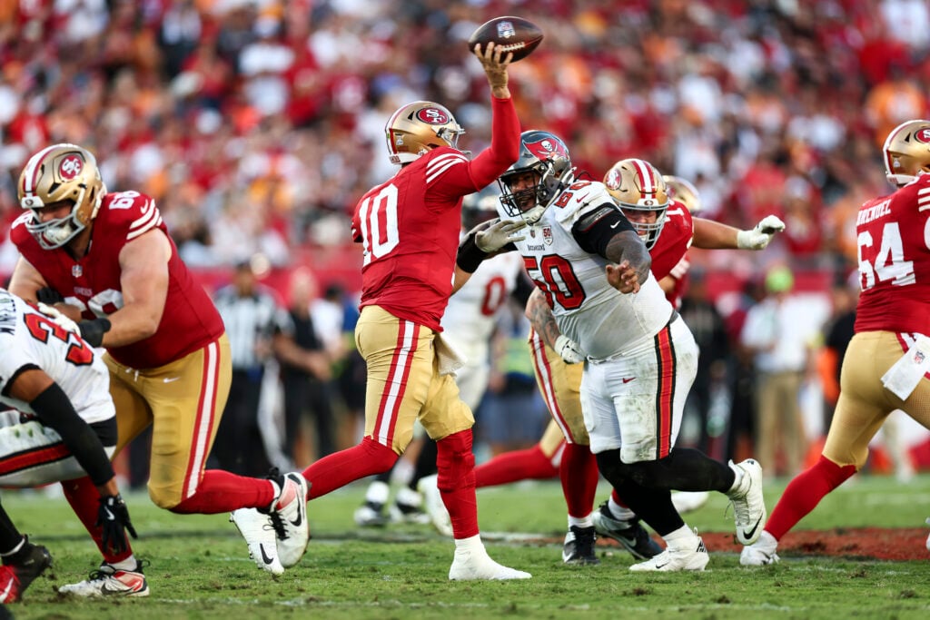 Vita Vea #50 of the Tampa Bay Buccaneers rushes Mac Jones #10 of the San Francisco 49ers during an NFL football game at Raymond James Stadium on October 12, 2025 in Tampa, Florida.