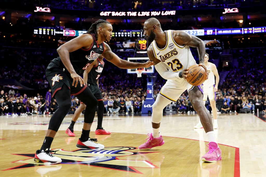Lebron James #23 of the Los Angeles Lakers drives against Jabari Walker #33 of the Philadelphia 76ers during the second half at Xfinity Mobile Arena on December 07, 2025 in Philadelphia, Pennsylvania.