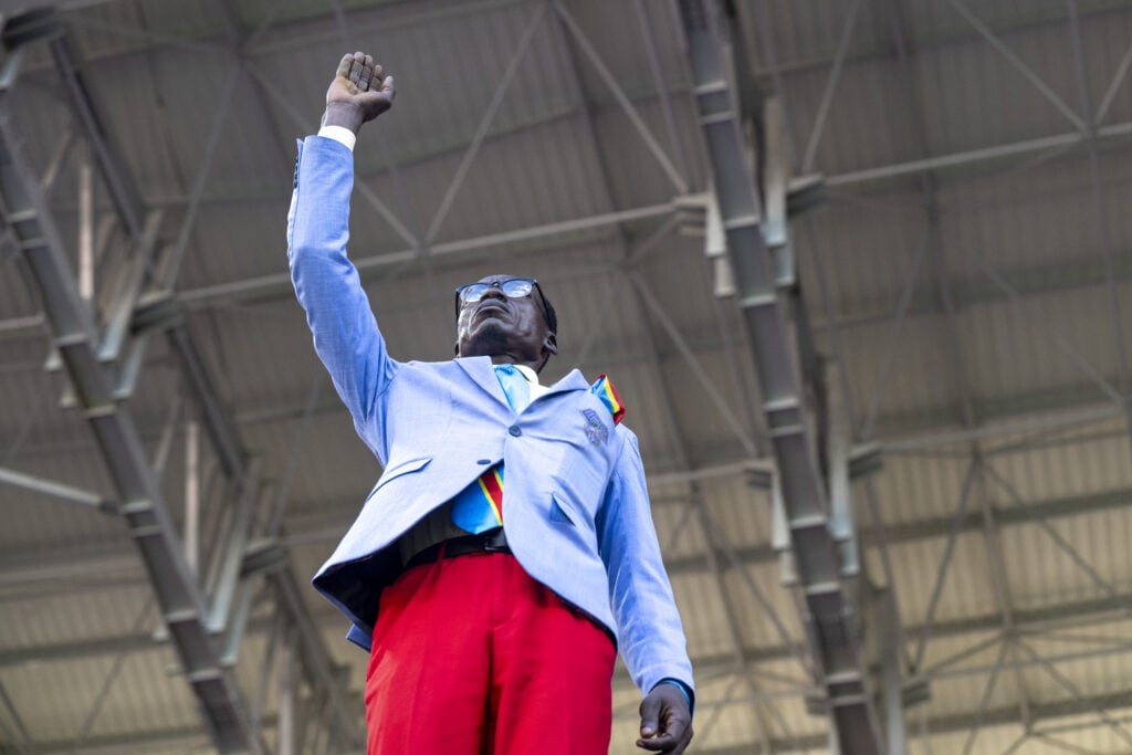 Congolese supporter Mboladinga backs team with raised-arm gesture