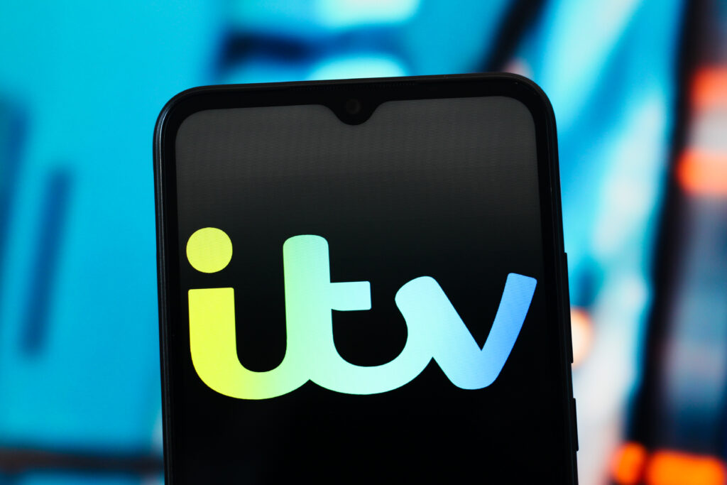In this photo illustration, the ITV logo is seen displayed