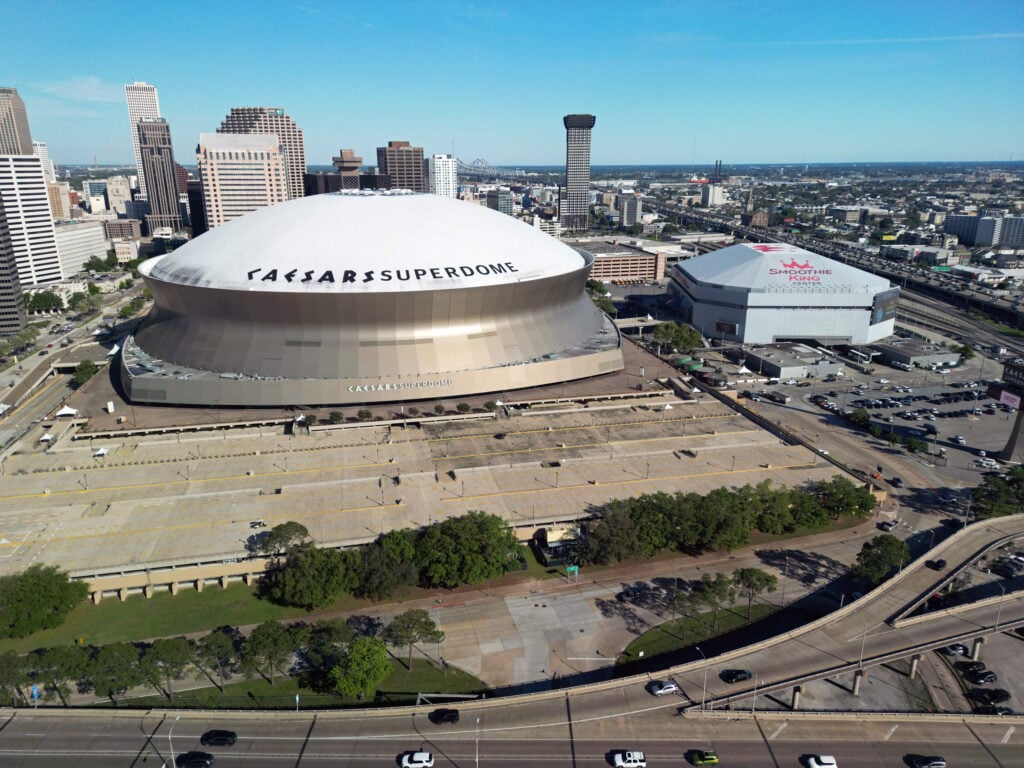 An aerial exterior general view of the Caesars Superdome and Smoothie King Center before the game between the New Orleans Pelicans and the Utah Jazz at Smoothie King Center