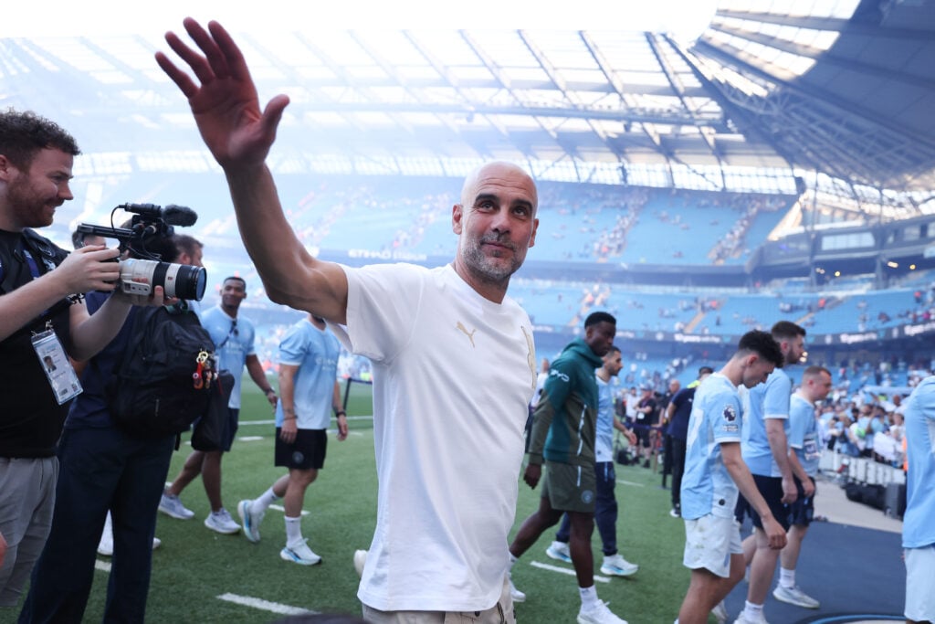 Josep 'Pep' Guardiola, head coach of Manchester City, waves goodbye to the Manchester City supporters after the Premier League match between Manchester City and Aston Villa at Etihad Stadium on May 24, 2026 in Manchester, England.