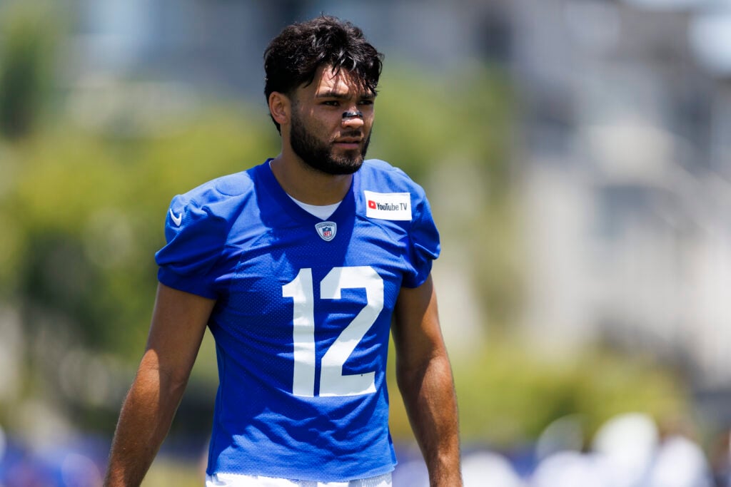 Puka Nacua #12 of the Los Angeles Rams walks during an OTA offseason workout at Rams Village at Warner Center.