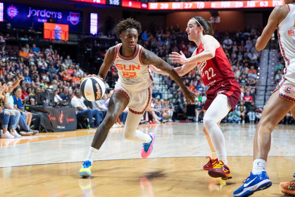 Saniya Rivers #22 of the Connecticut Sun dribbles the ball while guarded by Caitlin Clark #22 of the Indiana Fever during the WNBA game between the Indiana Fever and the Connecticut Sun on June 13, 2026 at Mohegan Sun Arena.