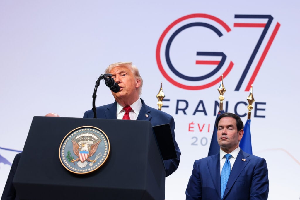.S. President Donald Trump speaks at a press conference as U.S. Secretary of State Marco Rubio (R) looks on during the G7 Leaders' Summit