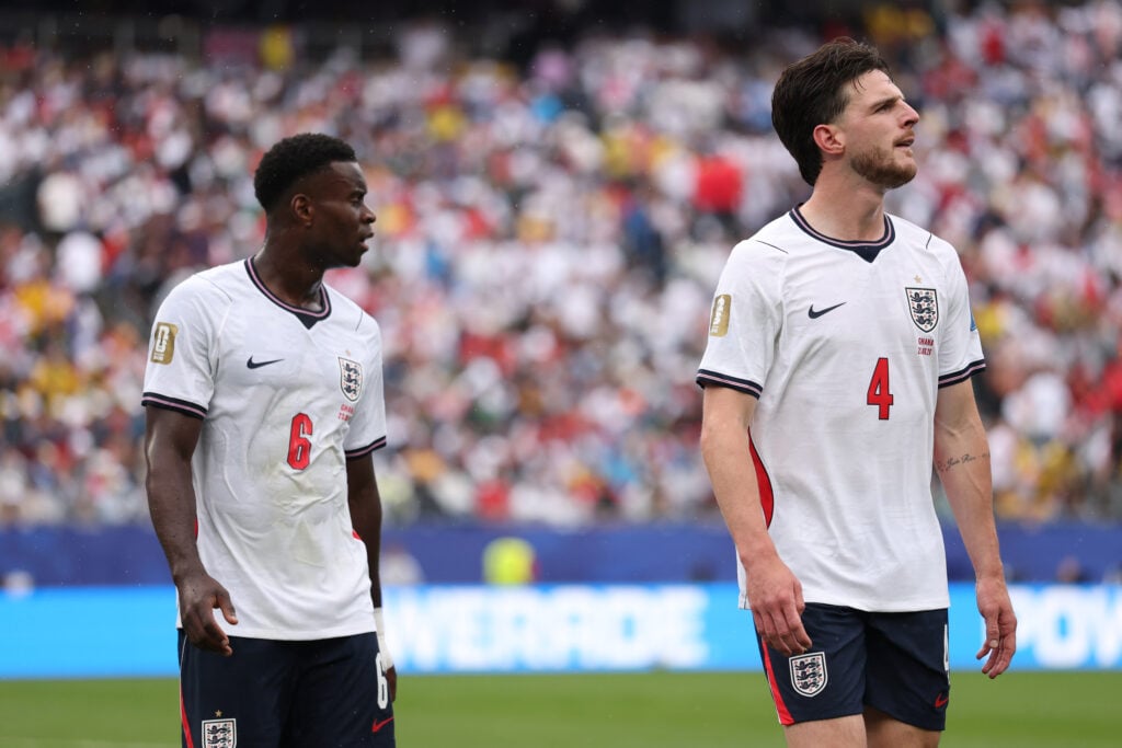 Marc Guehi #6 and Declan Rice #4 of England react at the hydration break during the FIFA World Cup 2026 Group L match between England and Ghana at Boston Stadium.
