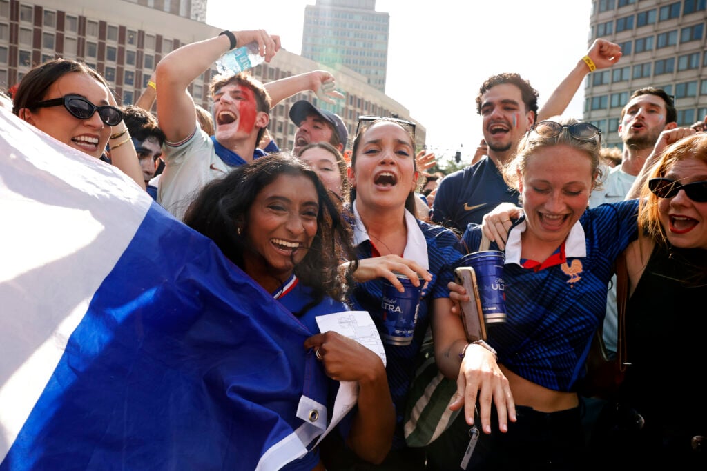 France soccer fans celebrate at the end of a FIFA World Cup match between Norway and France at the FIFA Fan Festival in City Hall Plaza.
