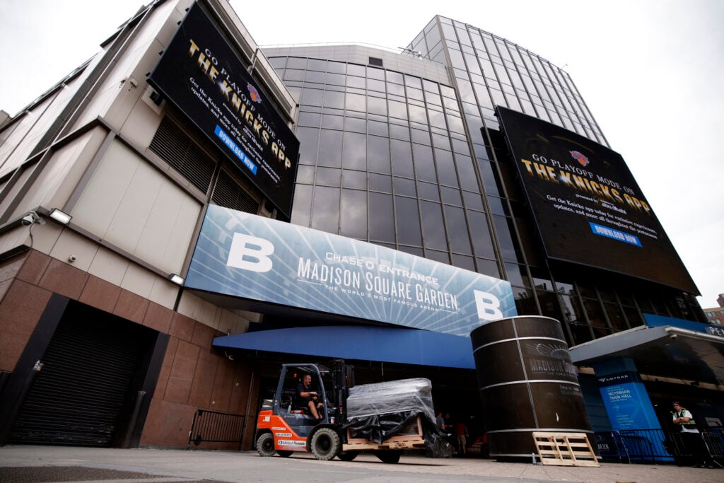 A worker drives a forklift outside Madison Square Garden in New York on June 30, 2026. Increasing signs point to a mega-bash for the A-list celebrity couple Taylor Swift and Travis Kelce.
