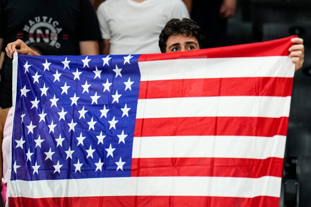 United States fans display their flag during the FIBA U17 Basketball World Cup final match between the United States and Serbia