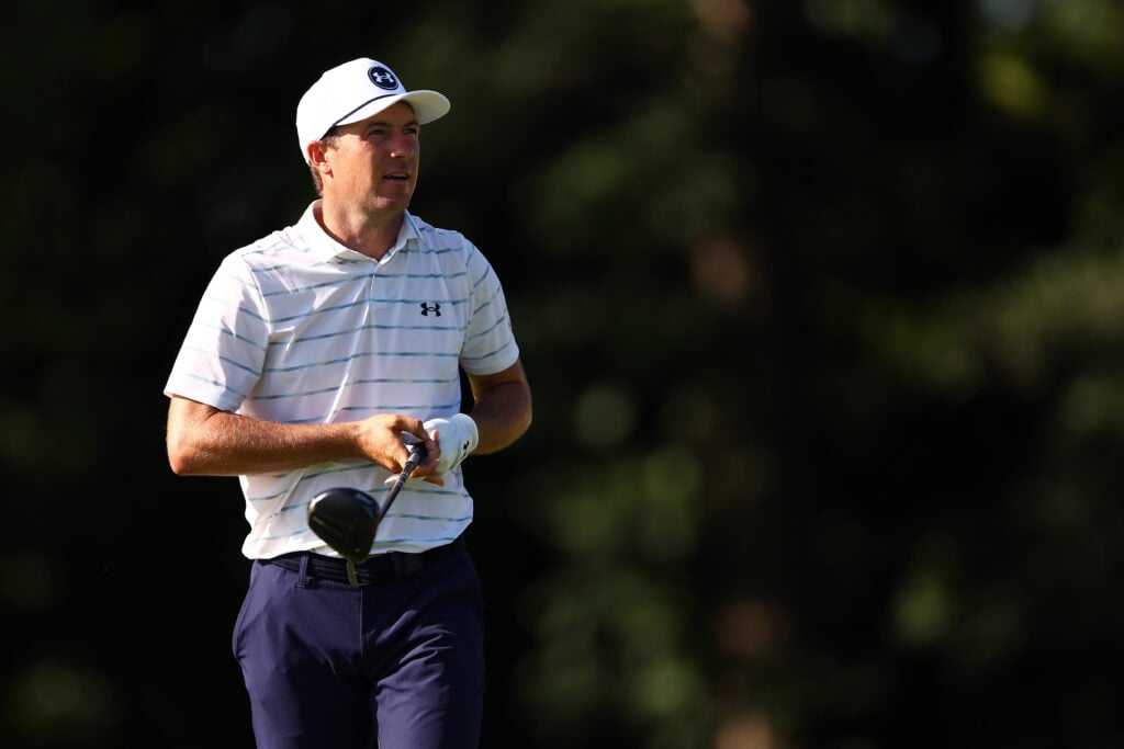 Jordan Spieth watches his tee shot on the 13th hole during the first round of the John Deere Classic