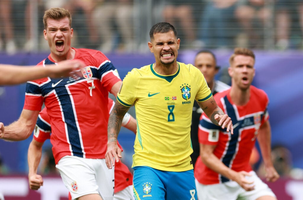 Bruno Guimaraes #8 of Brazil reacts after failing to convert a penalty as Alexander Sorloth #7 of Norway celebrates during the FIFA World Cup 2026 Round of 16 match between Brazil and Norway.