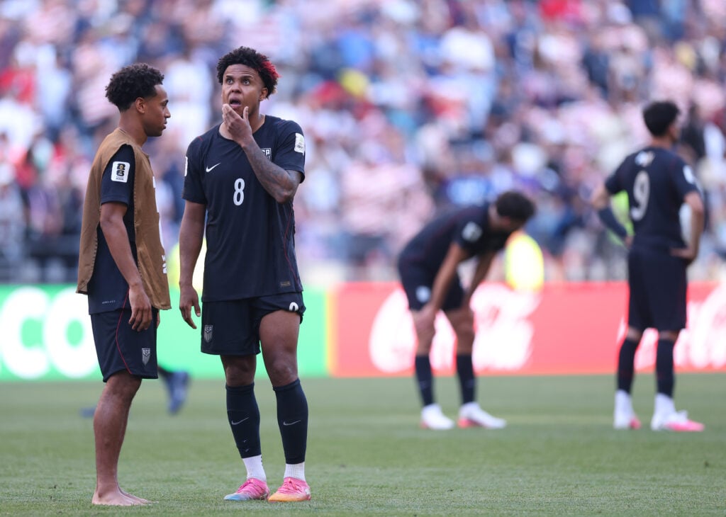 Tyler Adams #4 and Weston McKennie #8 of the United States react after the 1-4 loss during the FIFA World Cup 2026 Round of 16 match between USA and Belgium at Seattle Stadium on July 06, 2026 in Seattle, Washington.