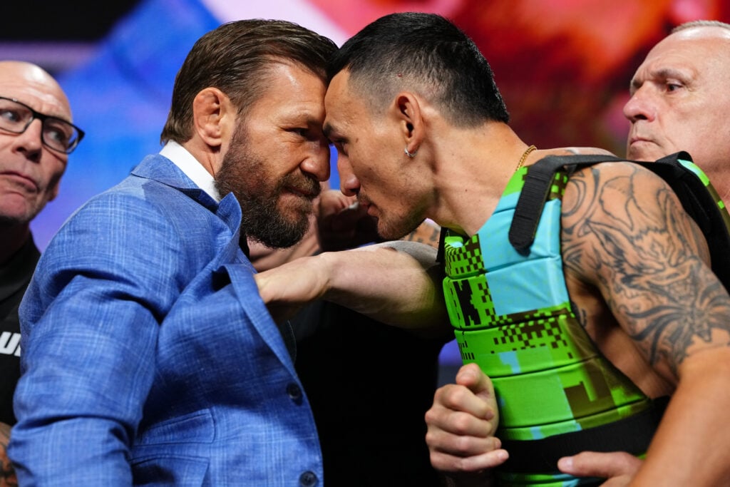 Conor McGregor and Max Holloway face off during the UFC 329 press conference at T-Mobile Arena