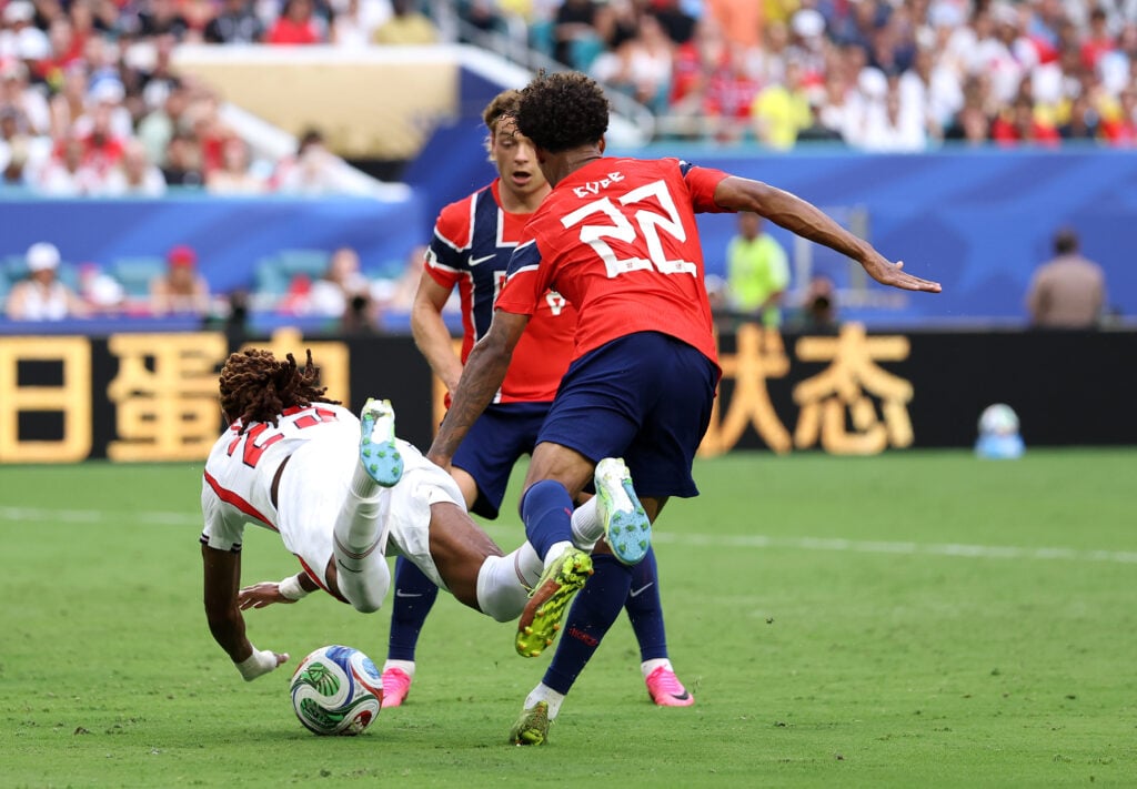 Oscar Bobb #22 of Norway fouls Djed Spence #25 of England in the box during the FIFA World Cup 2026 Quarter Final match between Norway and England at Miami Stadium.