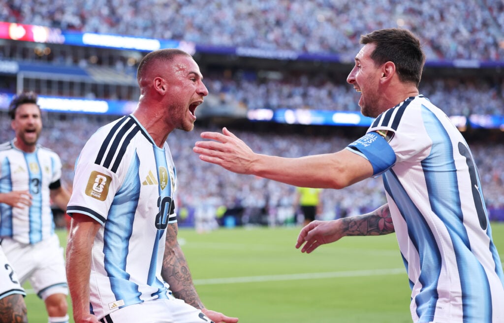 Alexis Mac Allister #20 of Argentina celebrates with Lionel Messi #10 after scoring the team's first goal during the FIFA World Cup 2026 Quarter Final match between Argentina and Switzerland at Kansas City Stadium
