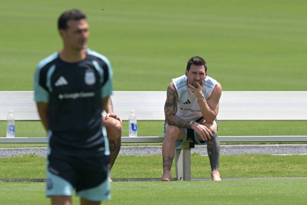 Lionel Messi (R) looks on as Argentina's head coach Lionel Scaloni (L) walks during a training session at the Atlanta United Training Centre in Marietta, Georgia, on July 16, 2026, ahead of the 2026 World Cup football tournament final match between Spain and Argentina.