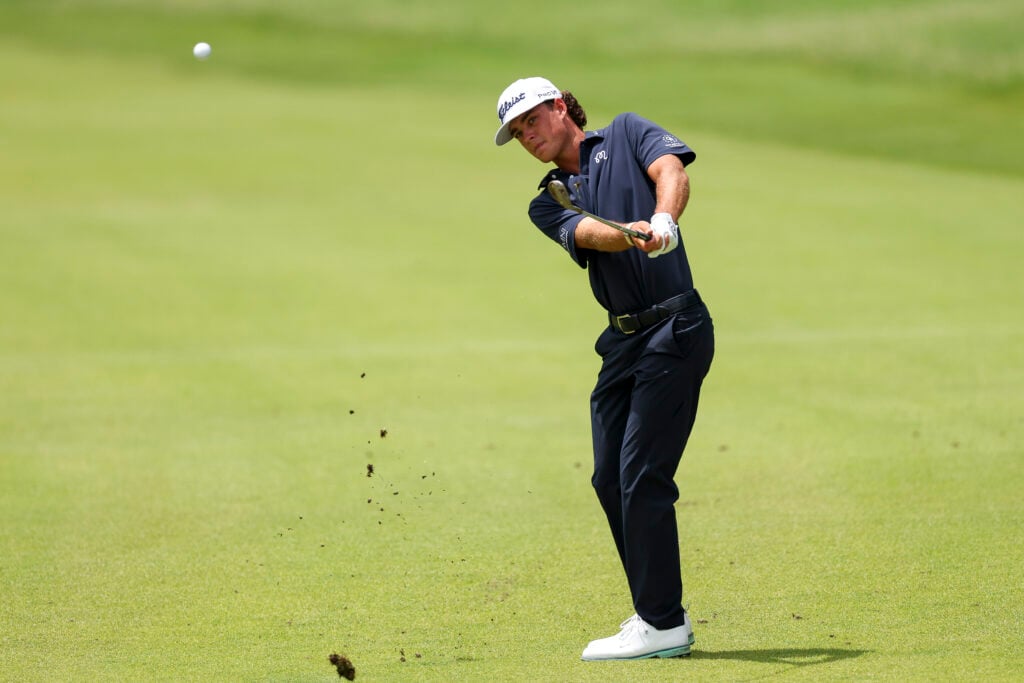 Jackson Koivun of the United States hits a chip shot on the seventh hole during the final round of the ISCO Championship 2026