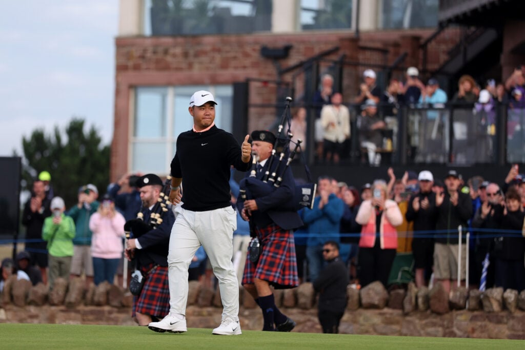 Tom Kim walks out during the presentation ceremony after winning the Scottish Open
