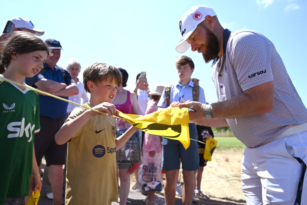 Tyrrell Hatton of England signs autographs for fans during a practice round prior to The 154th Open Championship at Royal Birkdale