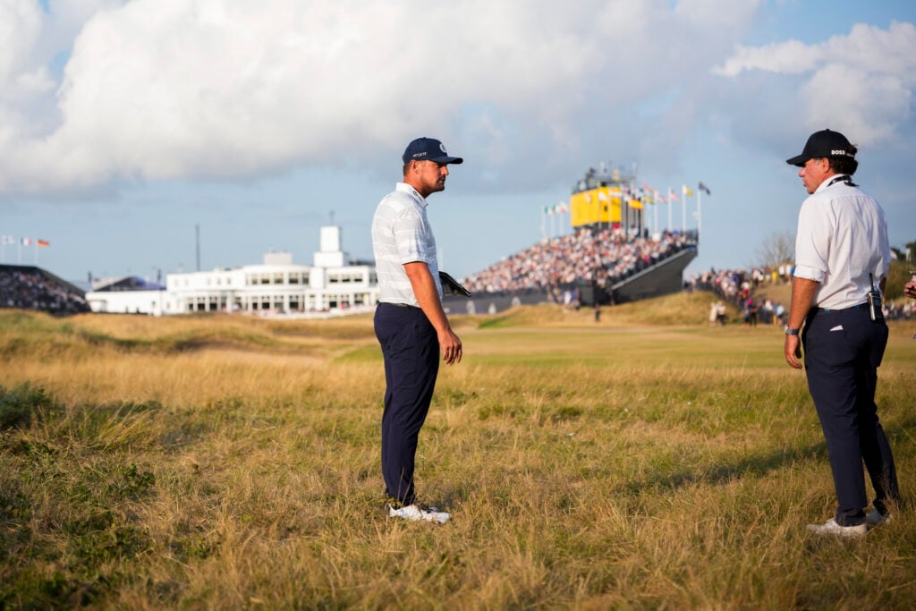 Bryson DeChambeau talks with the rules official on the 18th hole during the third round of The Open Championship