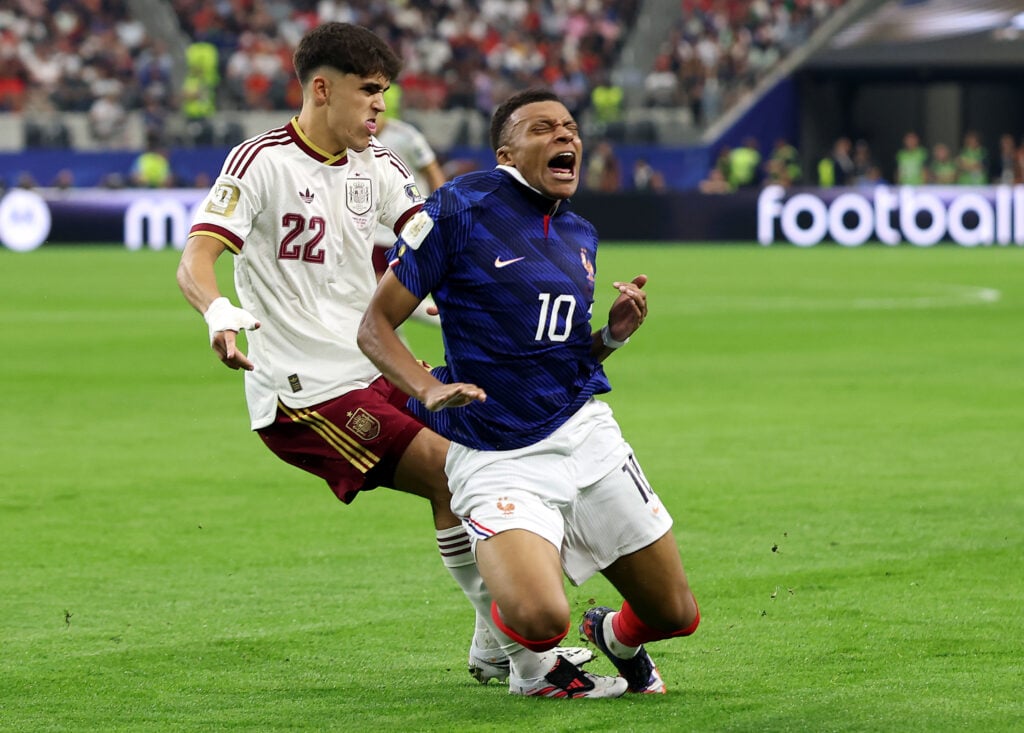 Kylian Mbappe #10 of France is challenged by Pau Cubarsi #22 of Spain during the FIFA World Cup 2026 Semi Final match between France and Spain at Dallas Stadium on July 14, 2026 in Arlington, Texas.