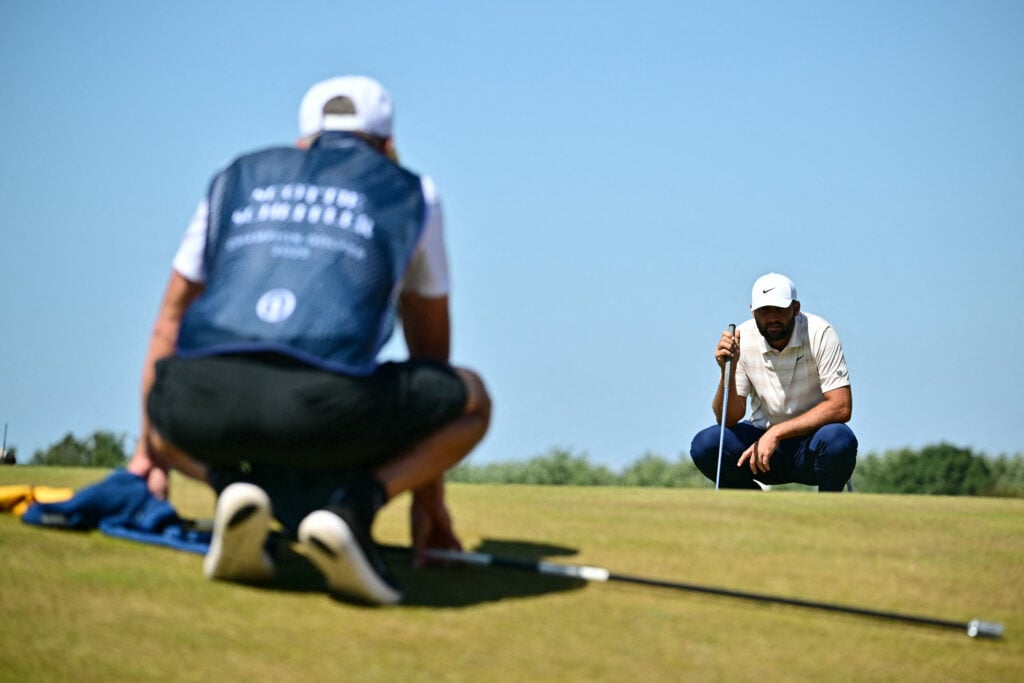 Scottie Scheffler lines up a putt on the ninth hole during the final round of The Open Championship