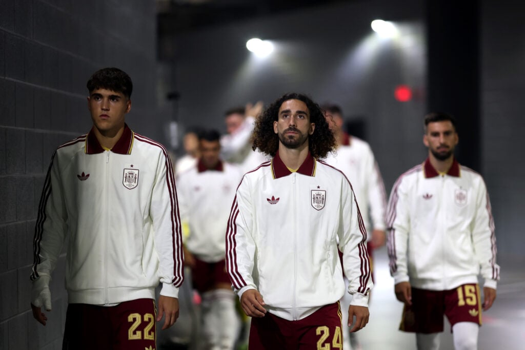 Pau Cubarsi #22, Marc Cucurella #24 and Alex Baena #15 of Spain walk out of the tunnel before the FIFA World Cup 2026 Semi Final match between France and Spain at Dallas Stadium.
