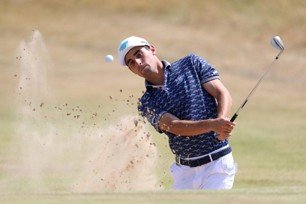 Joaquin Niemann hits from a bunker at Royal Birkdale during a practice round ahead of The Open Championship