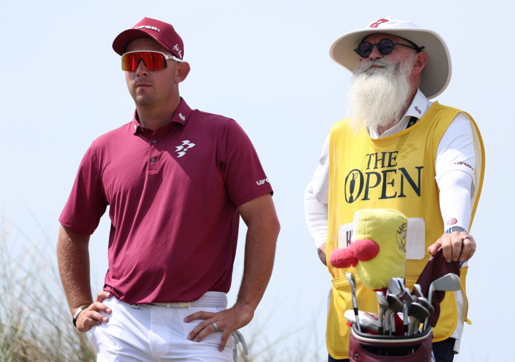 Lucas Herbert of Australia interacts with his caddie, Nick Pugh 13th tee on day two of the The 154th Open Championship