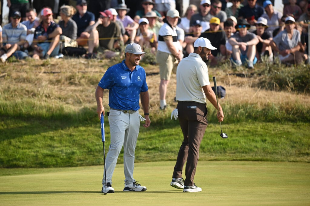 Bryson DeChambeau and Scottie Scheffler on the 11th green during Day Two of the The 154th Open Championship at Royal Birkdale
