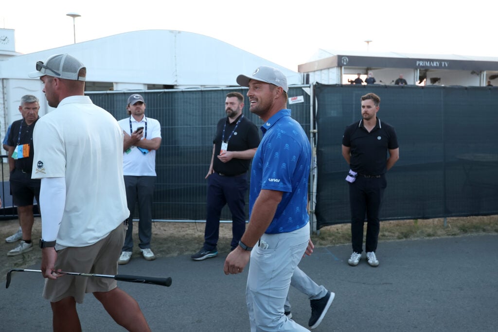 Bryson DeChambeau speaks with a rules official after his second round at The Open Championship