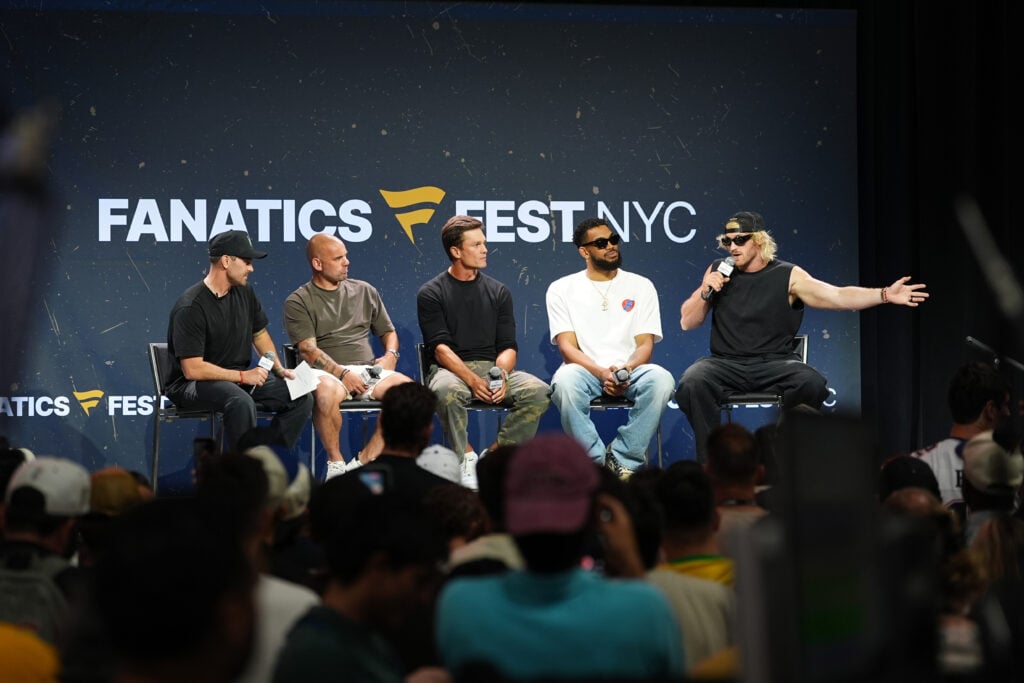 Chris Costa, Wesley Sneijder, Tom Brady, Karl-Anthony Towns, and Logan Paul speak onstage during the This is Why We Collect panel at Fanatics Fest NYC 2026 at Jacob Javits Center.