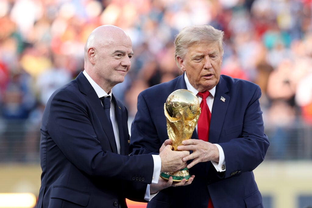 U.S. President Donald Trump and FIFA President Gianni Infantino hold the FIFA World Cup Winner's Trophy before handing over to captain Rodri #16 of Spain at the award ceremony following the FIFA World Cup 2026 Final match between Spain and Argentina.