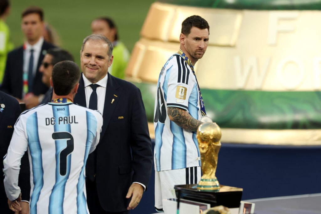 Lionel Messi #10 of Argentina walks past the FIFA World Cup Winner's Trophy after collecting his FIFA World Cup Runners Up Medal after the FIFA World Cup 2026 Final match between Spain and Argentina at New York New Jersey Stadium on July 19, 2026 in East Rutherford, New Jersey.