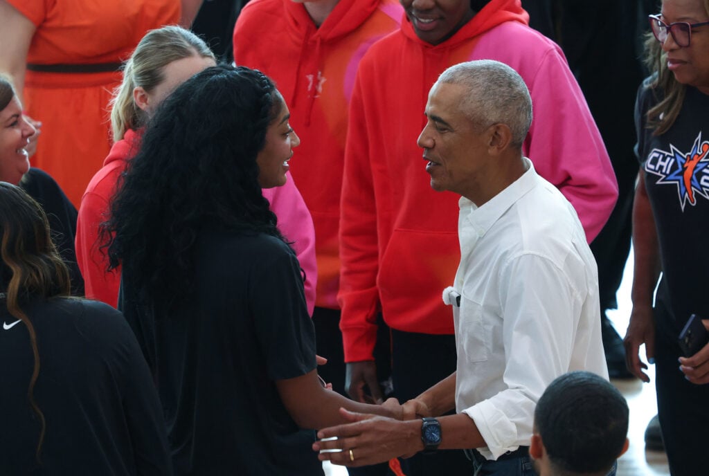 Former President Barack Obama greets WNBA players, including Angel Reese, before an All-Star Game practice at Home Court on the Obama Presidential Center campus.