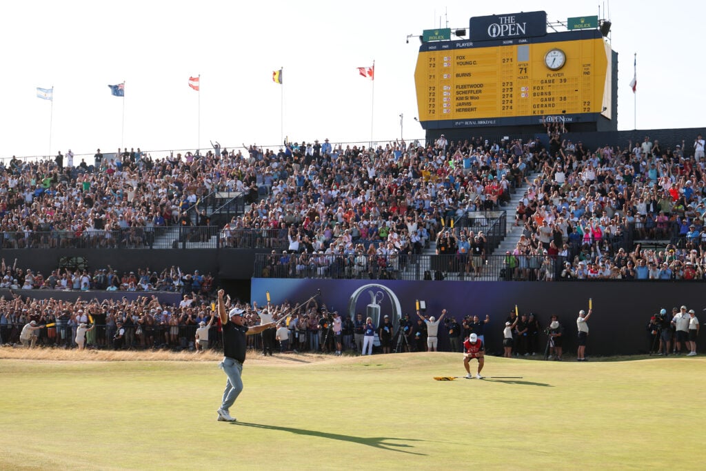Ryan Fox of New Zealand celebrates holing a birdie putt on the 18th green to secure victory on day four of the The 154th Open Championship