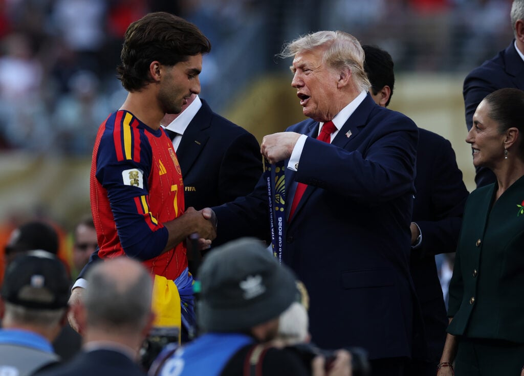Spain's forward #07 Ferran Torres (front) receives the gold medal from FIFA President Gianni Infantino and US President Donald Trump (R) during the final ceremony after the 2026 World Cup football tournament final match between Spain and Argentina at the New York/New Jersey Stadium in East Rutherford on July 19, 2026.