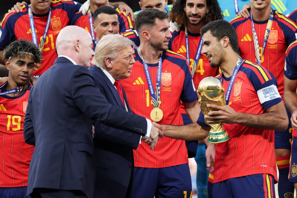 U.S. President Donald Trump and FIFA President Gianni Infantino hand the FIFA World Cup Winner's Trophy to captain Rodri #16 of Spain at the award ceremony following the FIFA World Cup 2026 Final match between Spain and Argentina at New York New Jersey Stadium.