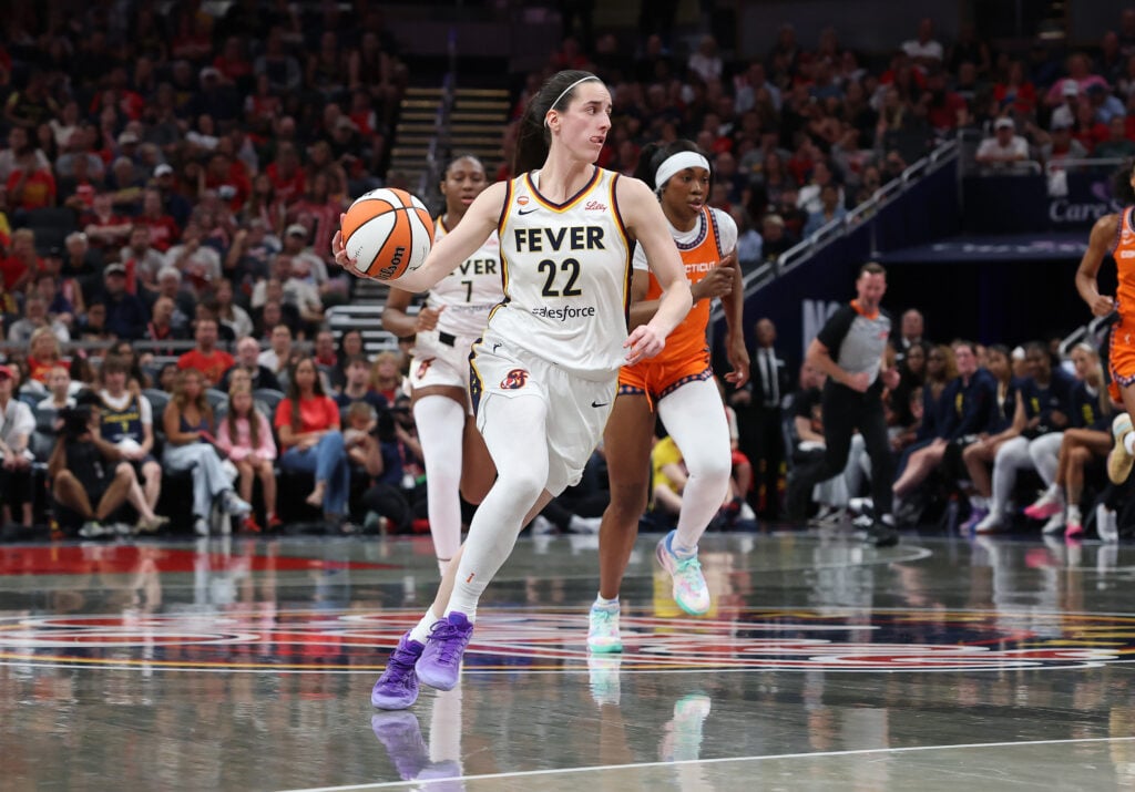 Caitlin Clark #22 of the Indiana Fever dribbles the ball against the Connecticut Sun at Gainbridge Fieldhouse