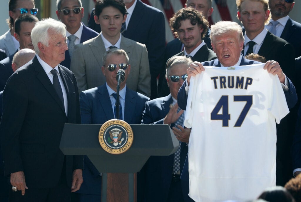 U.S. President Donald Trump is presented with a Los Angeles Dodgers jersey by Dodgers owner Mark Walter as he hosts the 2025 MLB World Series champions
