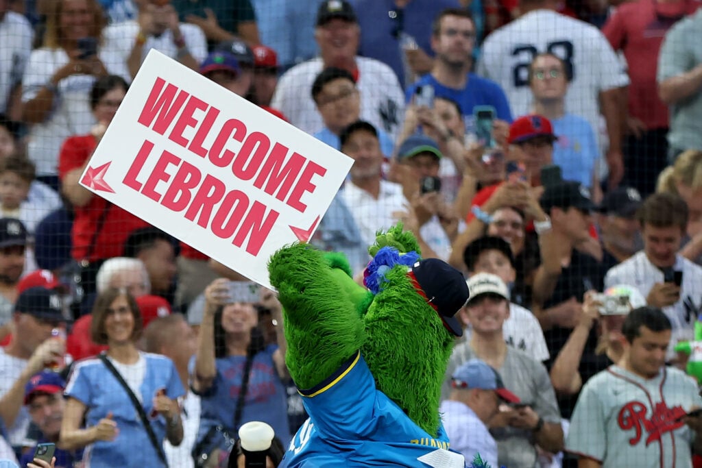 The Phillie Phanatic welcomes LeBron James to Philadelphia during a game between the Philadelphia Phillies and the New York Yankees at Citizens Bank Park.