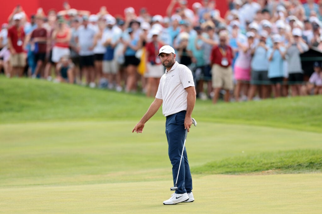 Scottie Scheffler reacts to his putt on the 18th hole during the final round of the 3M Open