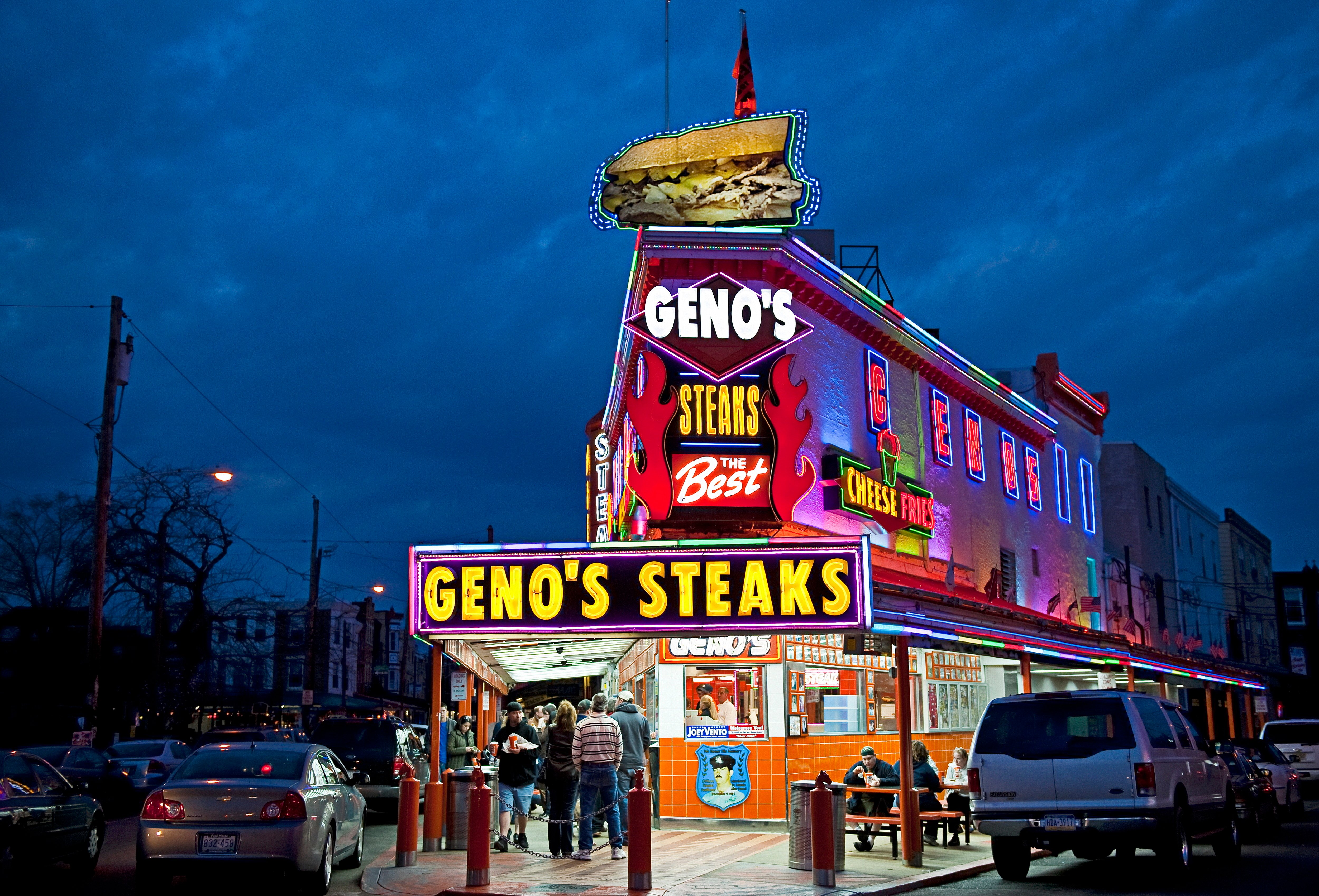 Famous Geno's Steaks at night